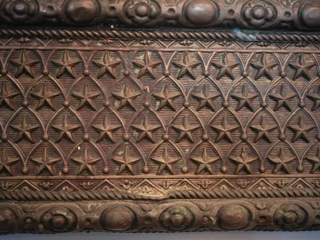 Curious large copper and wood mirror w/ medieval armor motifs