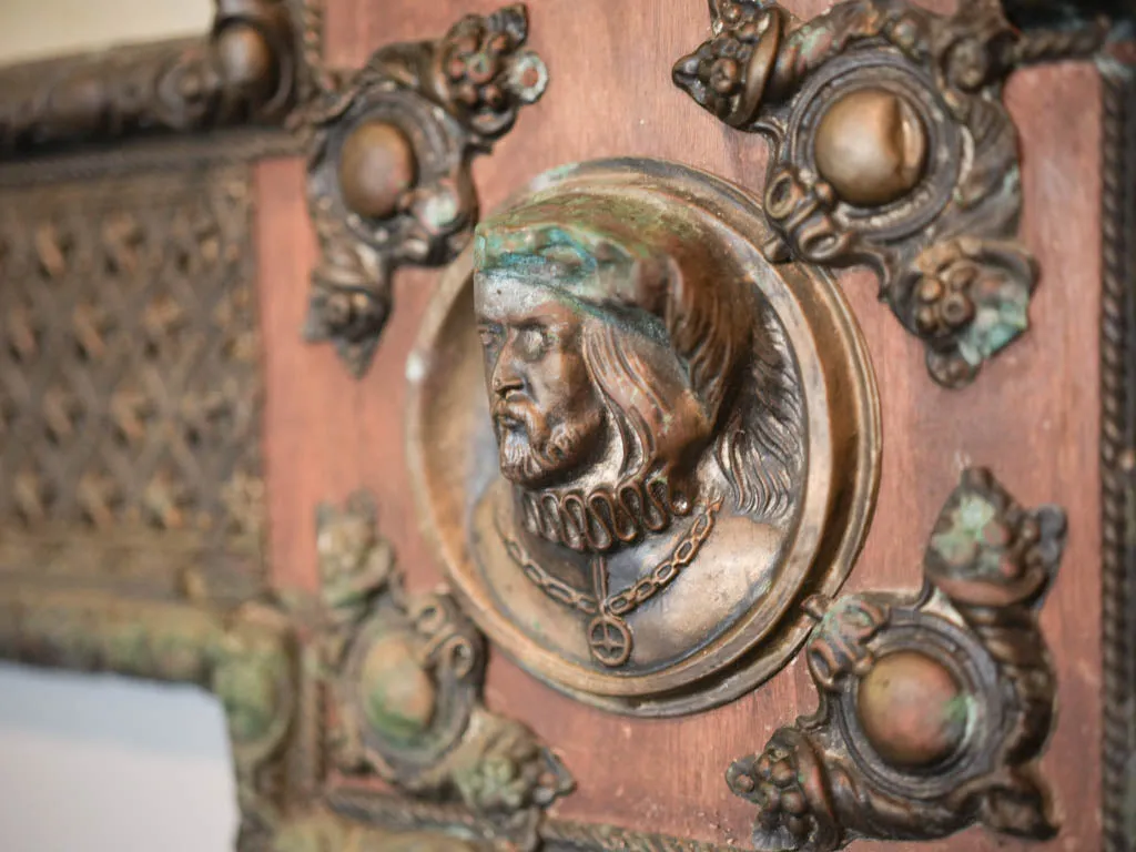 Curious large copper and wood mirror w/ medieval armor motifs