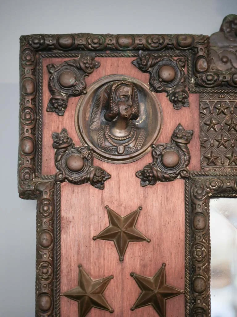 Curious large copper and wood mirror w/ medieval armor motifs