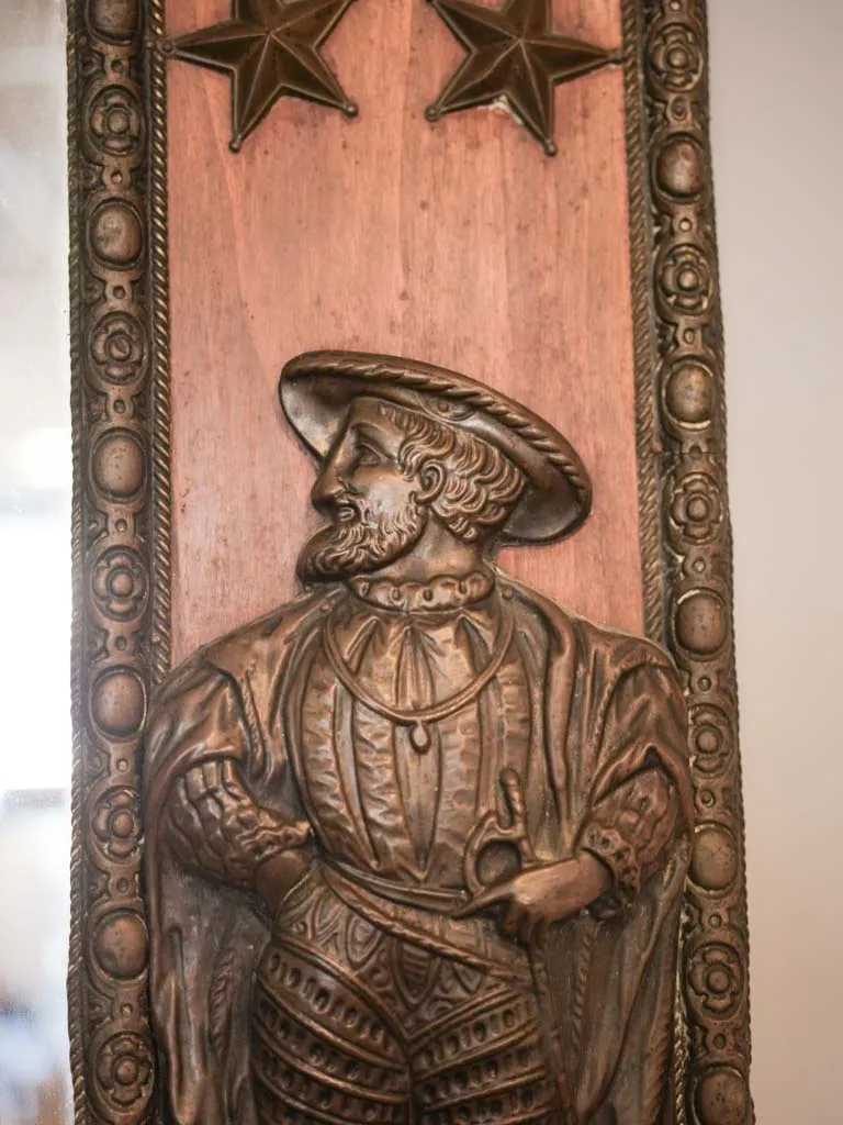 Curious large copper and wood mirror w/ medieval armor motifs